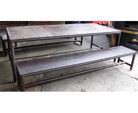 An industrial style steel rectangular table on turned supports, 100cm wide x 230cm long, together with a pair of matching ben