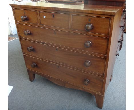 A George III, mahogany chest of three short and two long graduated drawers, on bracket feet, 104cm wide. 149