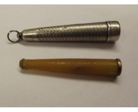 Yellow metal mounted cheroot holder in sterling silver engine turned case