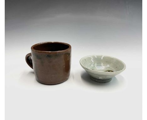 A Trevor Corser studio pottery mug, height 7cm, together with a small celadon glazed footed circular dish by the same potter,