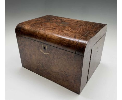 A Victorian walnut combined sewing and writing box, with brass inset top, the hinged front with slide-out writing slope, acti