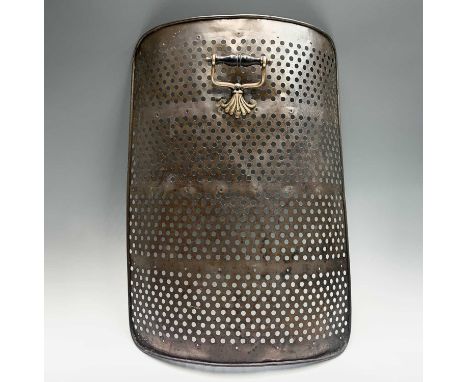 A 19th Century copper curfew or fireguard, of pierced rounded form, with ebonised brass mounted handle, height 71cm.