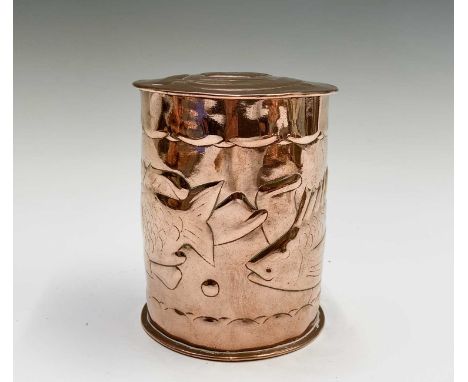 A Newlyn copper cylindrical tea caddy, the cover stamped "Tea", repousse decorated with two fish, stamped mark, height 11cm.