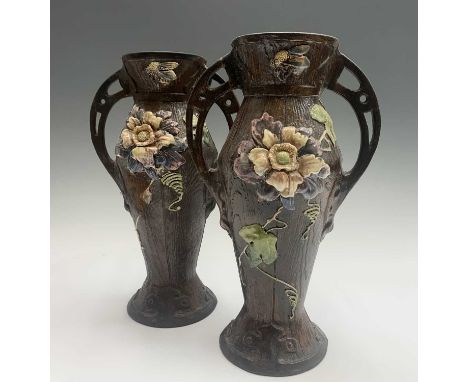 A pair of Art Nouveau period Bretby pottery twin handled faux bois vases, previously converted to lamp bases. Height 35cm.Pro