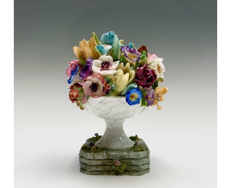A Rare Royal Worcester urn of flowers ornament, modelled by Mary Leigh, pattern number z214, date code for 1939, height 12cm.