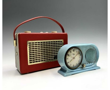 A Hacker Mini-Herald portable radio, model RP17, width 25cm, together with a Unity retro cased musical alarm clock (2).Condit