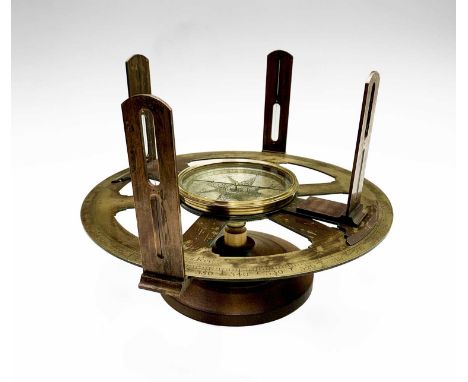 An early 18th century brass circumferentor, with central compass, raised on wood stand, circa 1730, the dial inscribed S. Sau