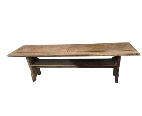 A 19th century pitch pine table/settle or monk's bench, the top now fixed, but formerly allowing the back of the settle to be