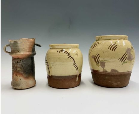 Two William 'Bill' Marshall (1923-2007) slipware lidded jars with sgraffito decoration, both having impressed marks, heights 