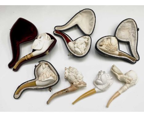 A Meerschaum pipe, the bowl carved with an eagle, 20th century, length 16.5cm together with six other 20th century pipes, one