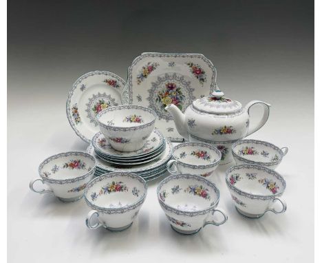 A Shelley 'Crochet' pattern tea service, comprising tea pot, sugar bowl, six tea cups, four saucers, six side plates and a ca
