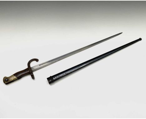 A French Gras bayonet, with two piece wood grips and brass pommel, with engraved triangular blade dated 1875, with scabbard, 