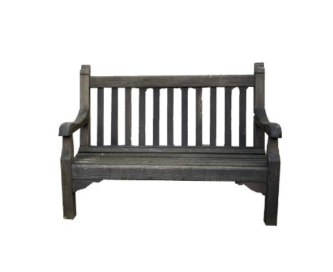 A wooden garden bench. Height 99cm, width 137.5cm, depth 58cm.