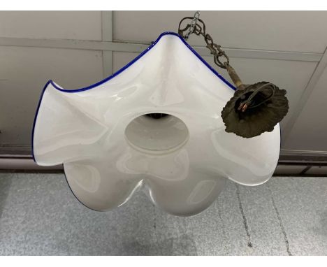 A gilt metal and white opaque glass hanging light pendant, mid 20th century, the shade with wide blue edged frill. Diameter 4