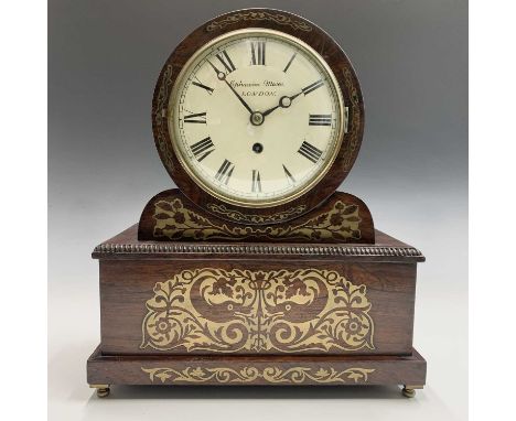 A Regency rosewood drum mantel clock, the dial signed Ephraim Moses, London, the case with brass inlaid decoration on a recta