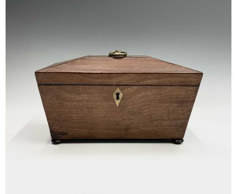 A Regency mahogany tea caddy, the interior with two lidded compartments and aperture for a mixing bowl. Width 28cm.