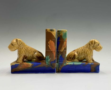 A pair of Beswick bookends, each modelled with a seated terrier. Height 13cm.Condition report: 806Light crazing throughout bu