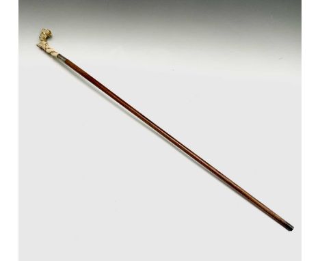 A walking stick, with 19th century French Dieppe ivory handle, carved with roses.