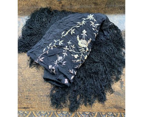 A vintage black silk embroidered &amp; fringed shawl, 95x95cm plus fringe together with a similar cream silk fringed shawl wi