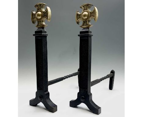 A pair of wrought iron and brass fire dogs, later 20th century, with Celtic cross finials, height 54.5cm.