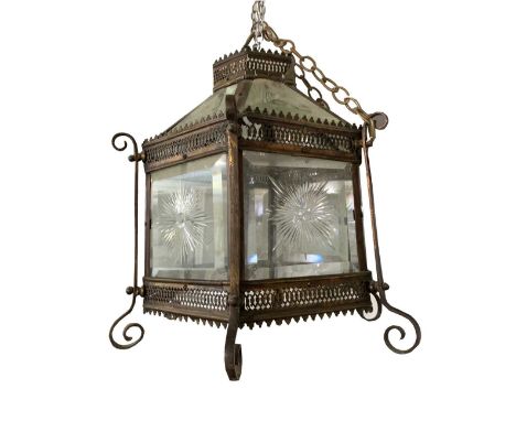 A hanging hexagonal ceiling lamp, mid 20th century, with star cut glass panels and pierced metal mounts, total width 36cm.