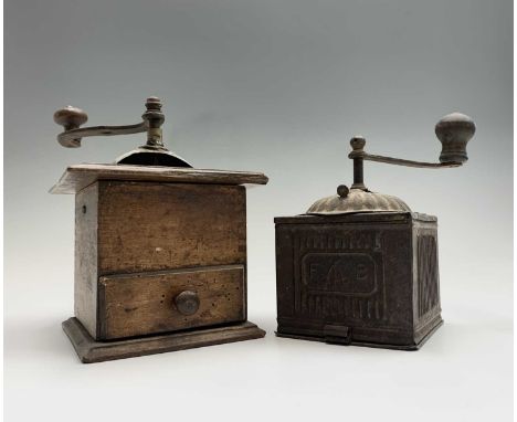 A French tin plate coffee grinder, circa 1900, stamped FB, height 17cm and a French beech and metal coffee grinder (2).