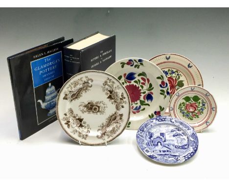 Five Swansea pottery plates, with variously painted, moulded and printed decoration, circa 1820, together with a facsimile co