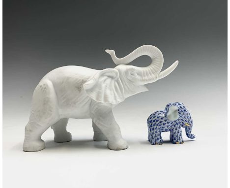 A Herend porcelain elephant, having blue scale and gilt decoration, height 4.5cm, together with a Rosenthal Studio-Haus bisqu