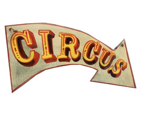 A signwritten arrow-shaped wooden sign 'CIRCUS', having red border. 42.5 x 79cm (irregular).