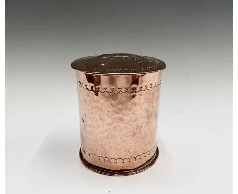 A Newlyn copper cylindrical tea caddy, the cover repousse decorated with a fish, stamped mark, height 11cm.