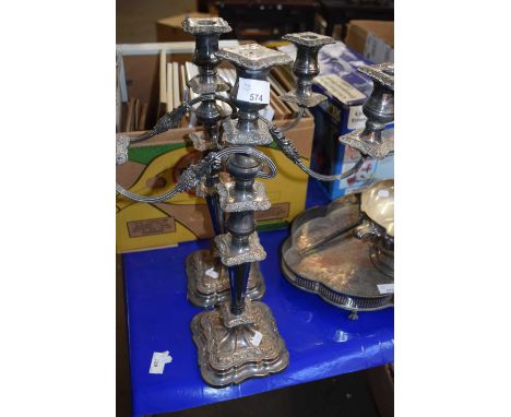 A pair of electro plated three branch candelabra