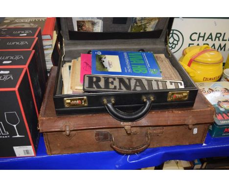 A briefcase and a suitcase of assorted ephemera, stamps and other items