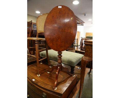 A 19th century mahogany oval tilt top occasional table, on bobbin turned tripod splay support, 21" wide x 15" deep x 27" high