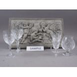 A quantity of clear glass pedestal drinking glasses, including four brandy balloons, a composition