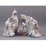 A Lladro Nativity group, Mary, Joseph and Jesus, 10" high, and three Lladro figures, the three