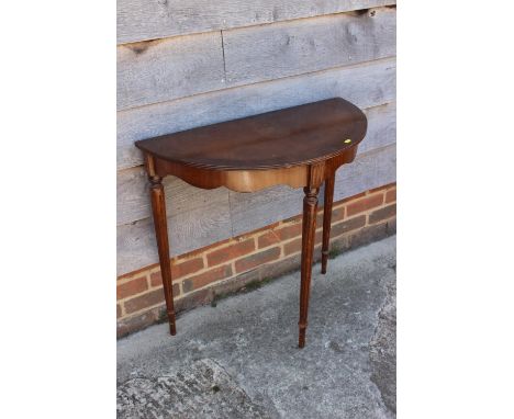A mahogany 'D' shaped console table, 29" wide, an oval pie crust occasional table, on tripod support, 17" wide, and a dressin