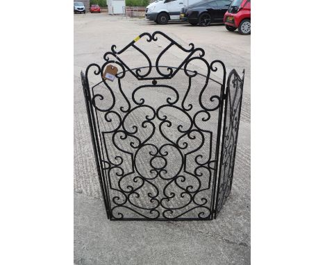A wrought iron scroll work three-fold firescreen, centre panel 24" wide x 41" highCondition:No apparent damages to the mesh, 