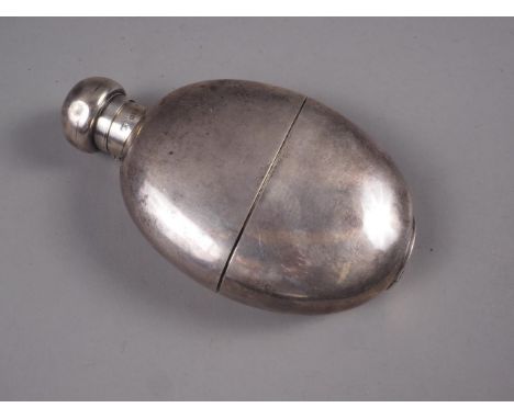 A Mappin & Webb oval-shaped hip flask with removable cup, 5 1/2" highCondition:Dings to the top and side, surface scratches i