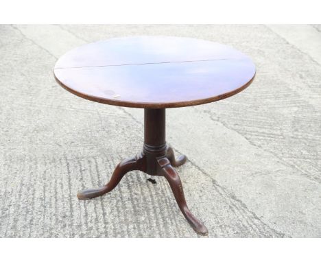 A 19th century mahogany circular tilt top table, on turned column and tripod splay supports, 30" dia x 29" high 