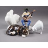 A Rosenthal blanc-de-chine model of a bull, 4 1/2" high, a Kensington Winstanley model of a cat, a