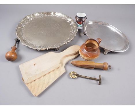 Two 19th century pastry cutters, a horn lemon squeezer, a miniature stoneware jug, a silver plated teapot stand, a pair of wo