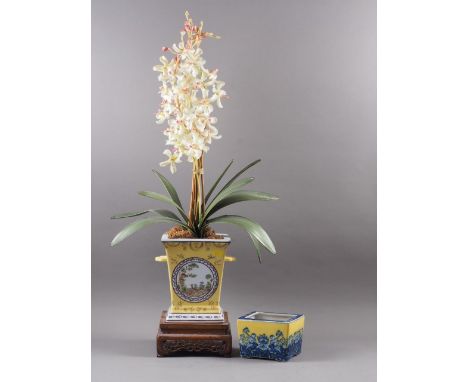 A porcelain yellow ground blue and white decorated two-handled jardiniere, on carved hardwood stand, jardiniere 8 1/2" high, 