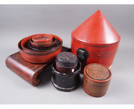 A red lacquered hardwood stand, 12 1/2" wide, a quantity of similar lacquered boxes, a Chinese pottery reclining figure, 14 1
