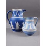 A 19th century Wedgwood dark blue jasperware water jug with silver lid, 7 1/2" overall, decorated
