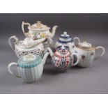 A 18th century Worcester bullet teapot, two Worcester drum teapots, a similar tea caddy and other