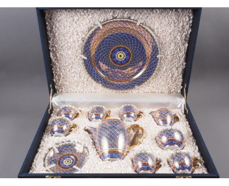 A Thai porcelain coffee set, decorated in a yellow, crimson and gilt floral pattern on a blue ground, eighteen pieces includi