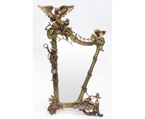 AN ORMOLU BRONZE FRAMED TABLE MIRROR, LATE 19TH CENTURY asymmetrical, the frame of rocaille form, depicting a trumpeting ange