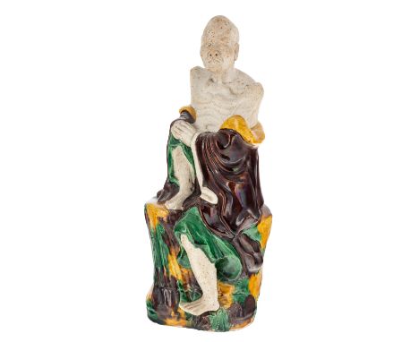 A CHINESE EGG AND SPINACH BISQUE FIGURINE OF AN ARHAT, LATE QING DYNASTY, 18TH-19TH CENTURY partly glazed, depicting an arhat