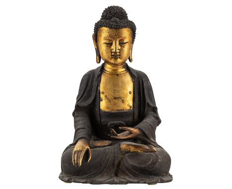 A GILT BRONZE FIGURE OF BUDDHA SHAKYAMUNI, MING DYNASTY, 16TH-17TH CENTURY bronze with dark brown patina, the face, torso, ar