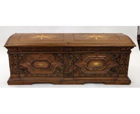 A LARGE WOODEN CHEST, 19TH CENTURY the top and front featuring pairs of eight-pointed stars, the front featuring a carved fri